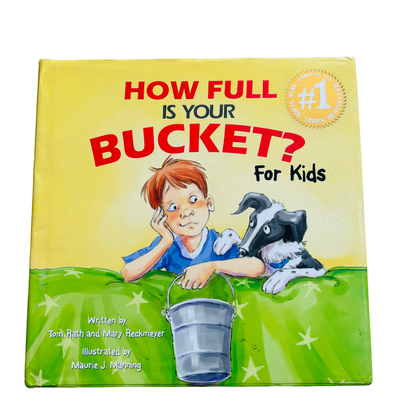 Book titled 'How Full is Your Bucket? For Kids' with a colorful cover featuring a child and dog.