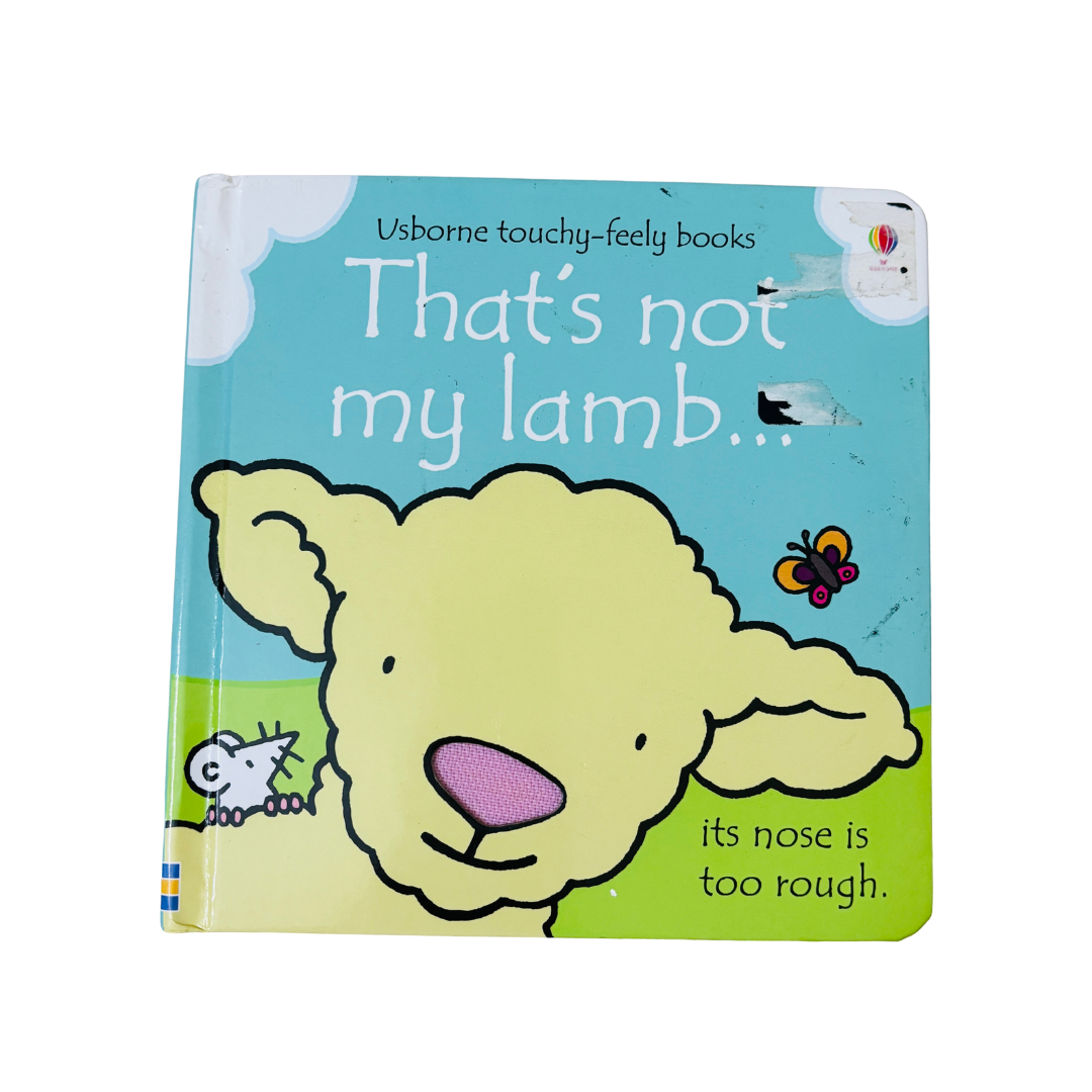 Book cover of 'That's not my lamb' with a cartoon sheep and blue background