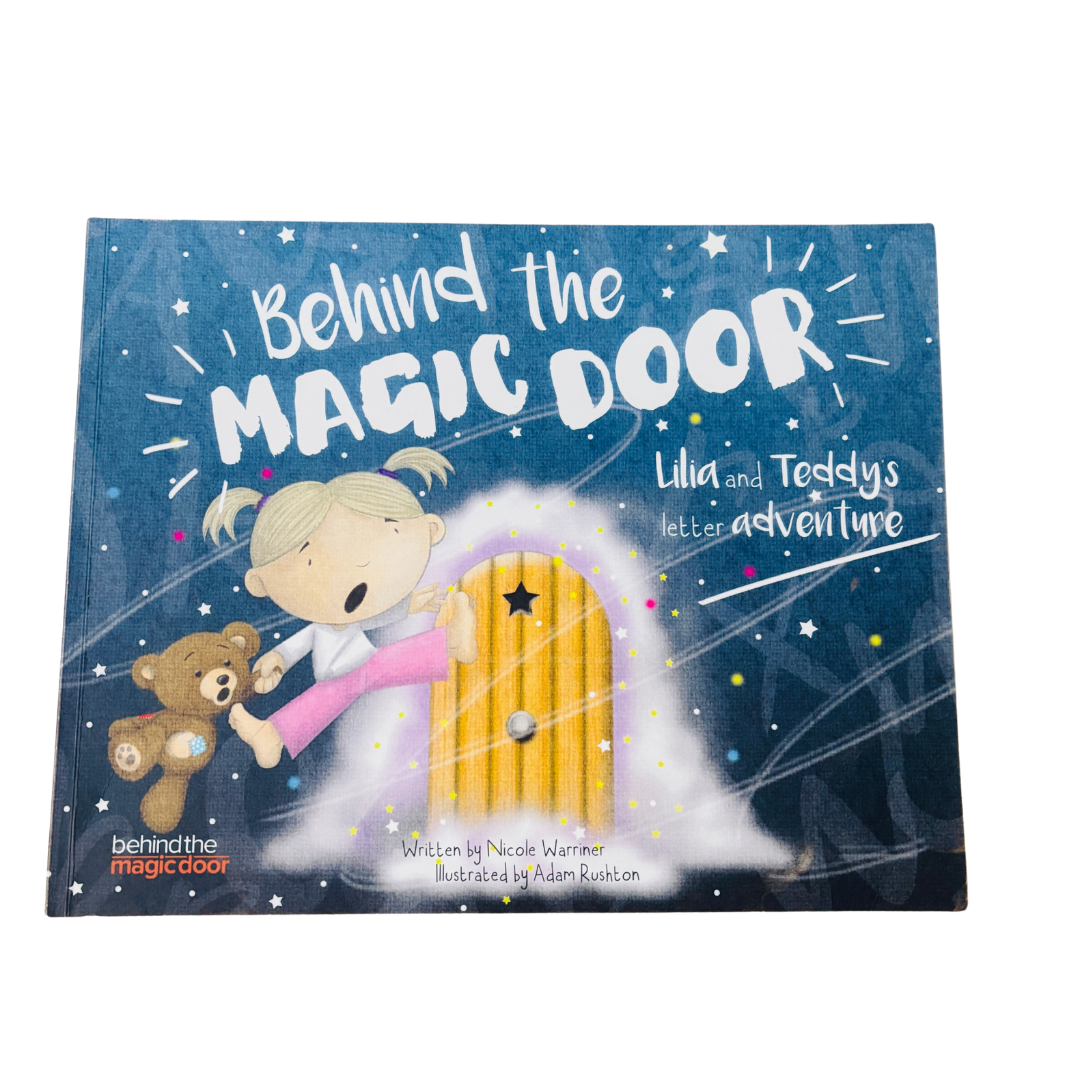 Book titled 'Behind the Magic Door' with a cover illustration of a child and teddy bear opening a door.