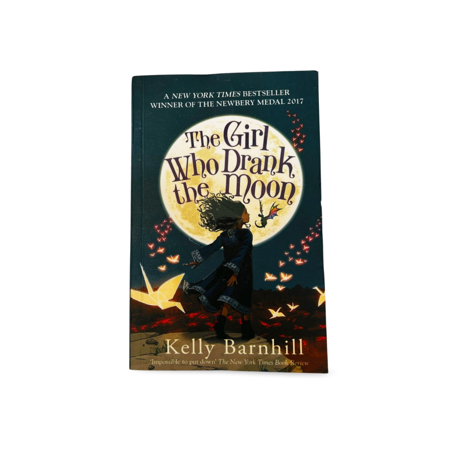 Book cover of 'The Girl Who Drank the Moon' by Kelly Barnhill with a silhouette of a person and moon in the background.