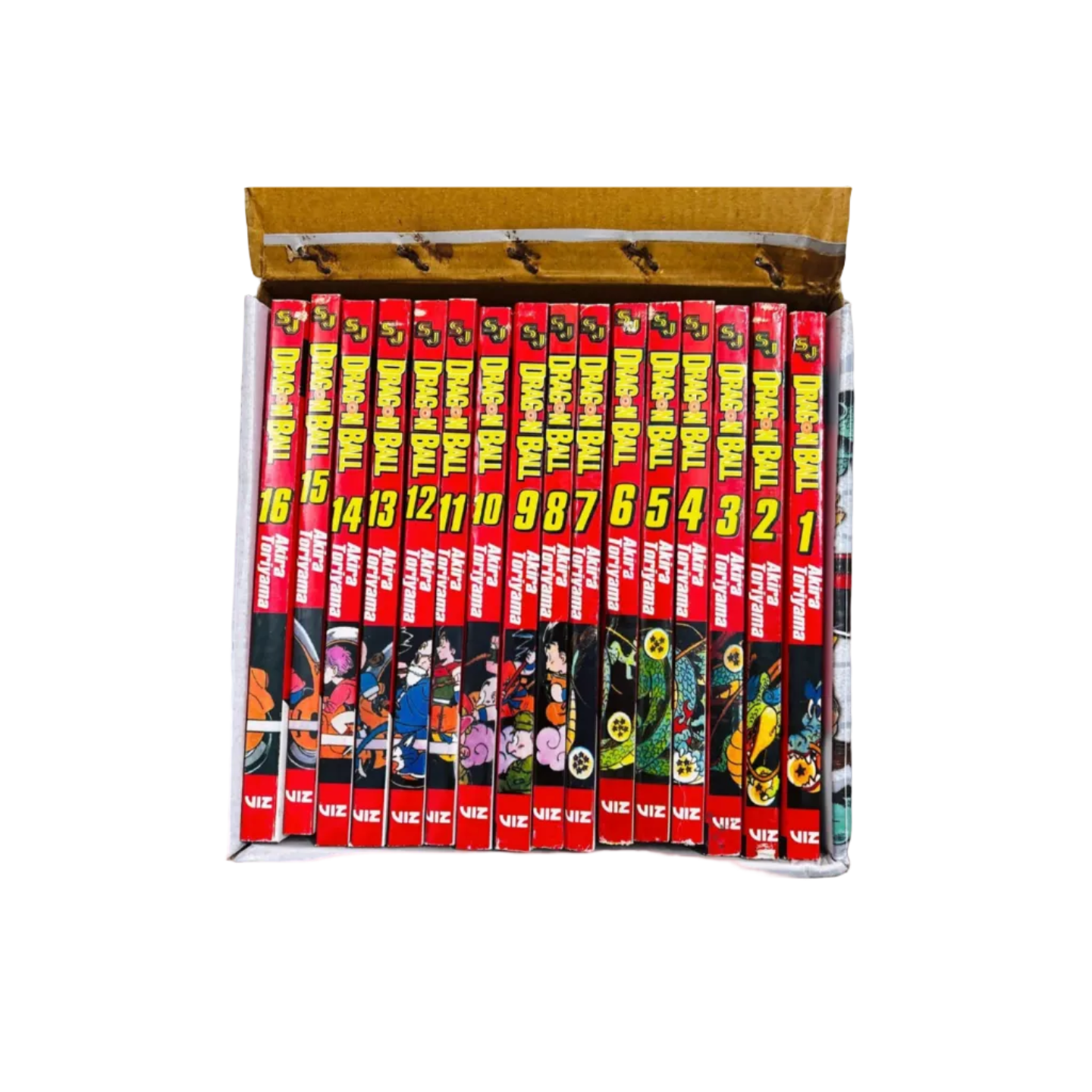 Collection of 'Dragon Ball' and 'Akira' manga books stacked in a box.