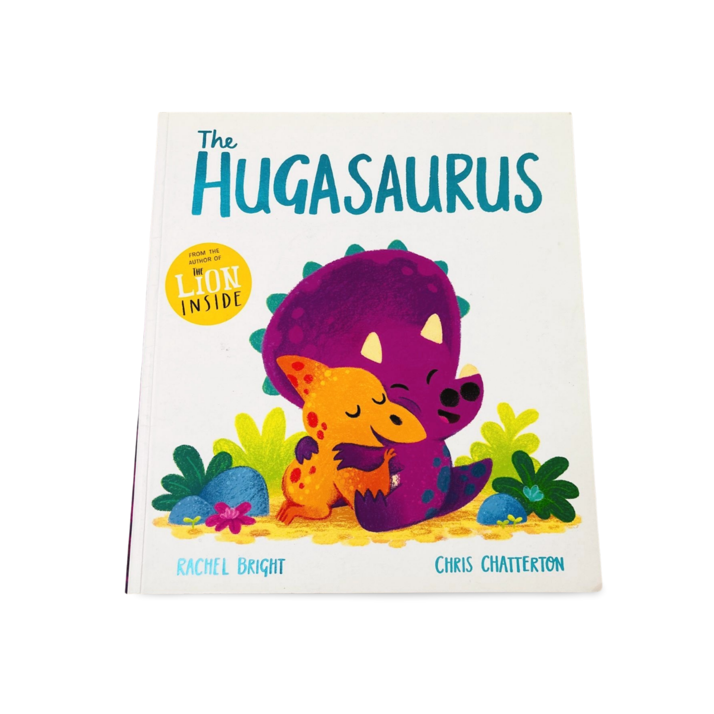 Children's book titled 'The Hugasaurus' with colorful illustration of two dinosaurs hugging on a white background.